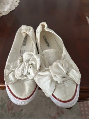 Converse Women's White Slip-On Bow Sneakers with Red Accent